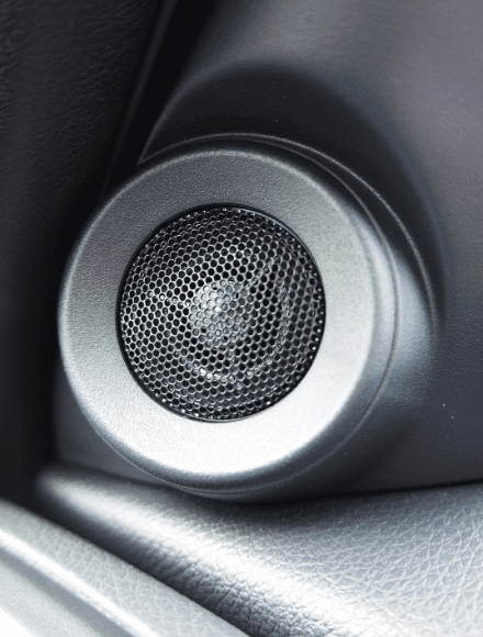 A tweeter installed in a car.