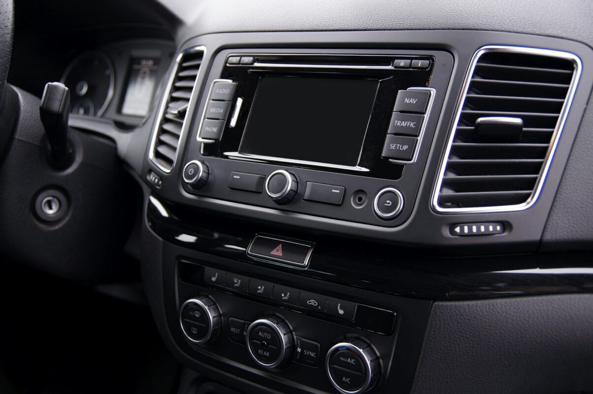 Aftermarket car stereo head unit in a dashboard