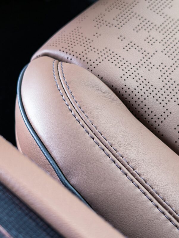 Tan leather car seat with detailed stitching