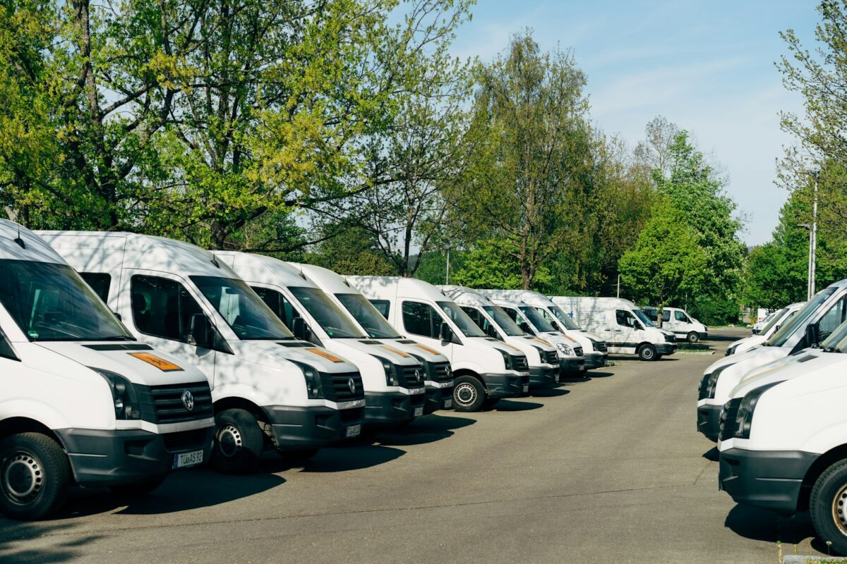 Row of white fleet vans