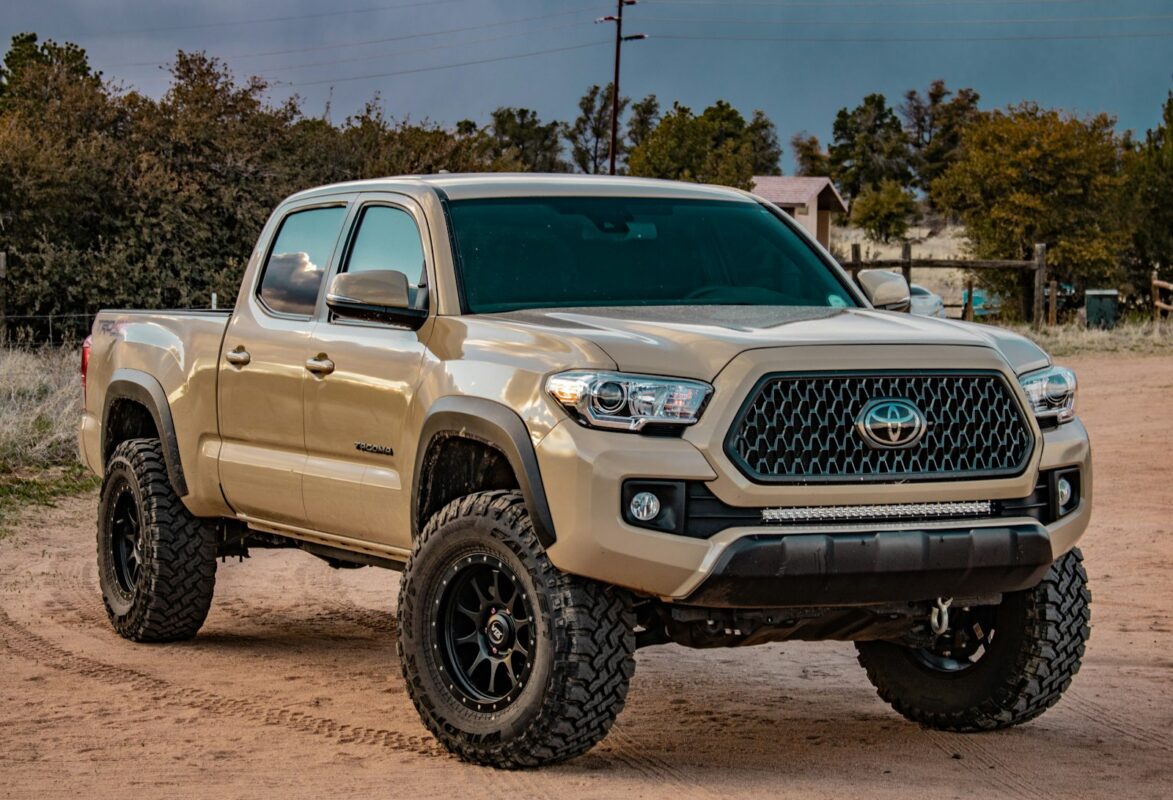 Lifted off-road pickup truck on a dirt trail